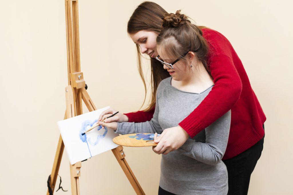 Girl being taught through art in an SEN school